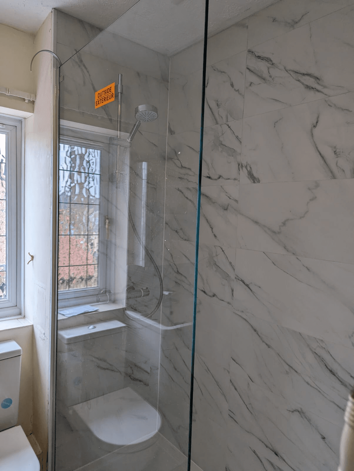 Marble wetroom with glass screen