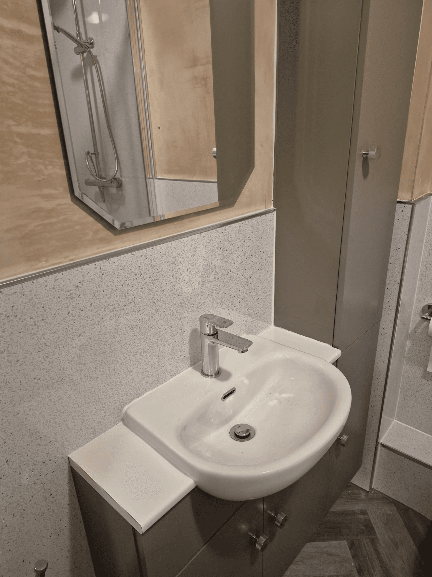 Compact shower room with basin, vanity unit and shower enclosure