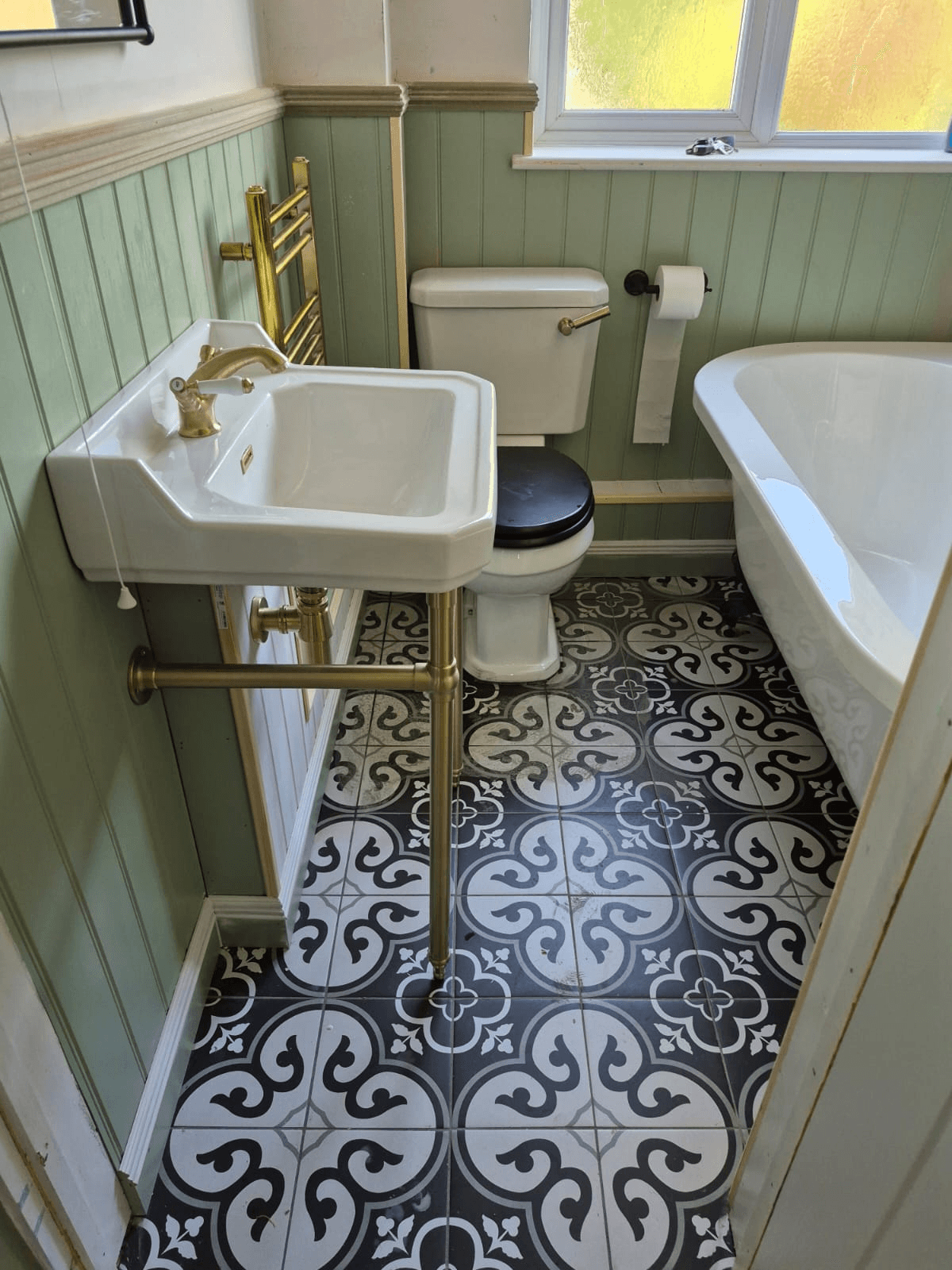 Victorian bathroom with sage panelling installed by Deene's Bathrooms